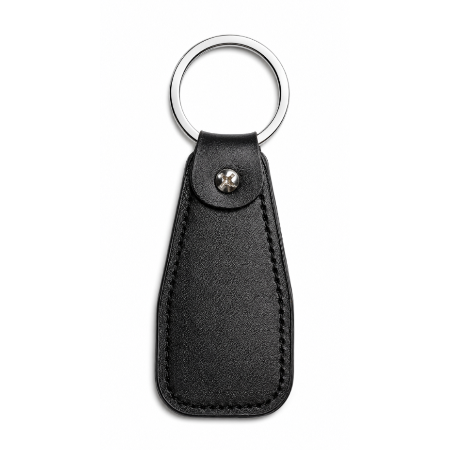 Black leather keychain with metal ring and button on a white background