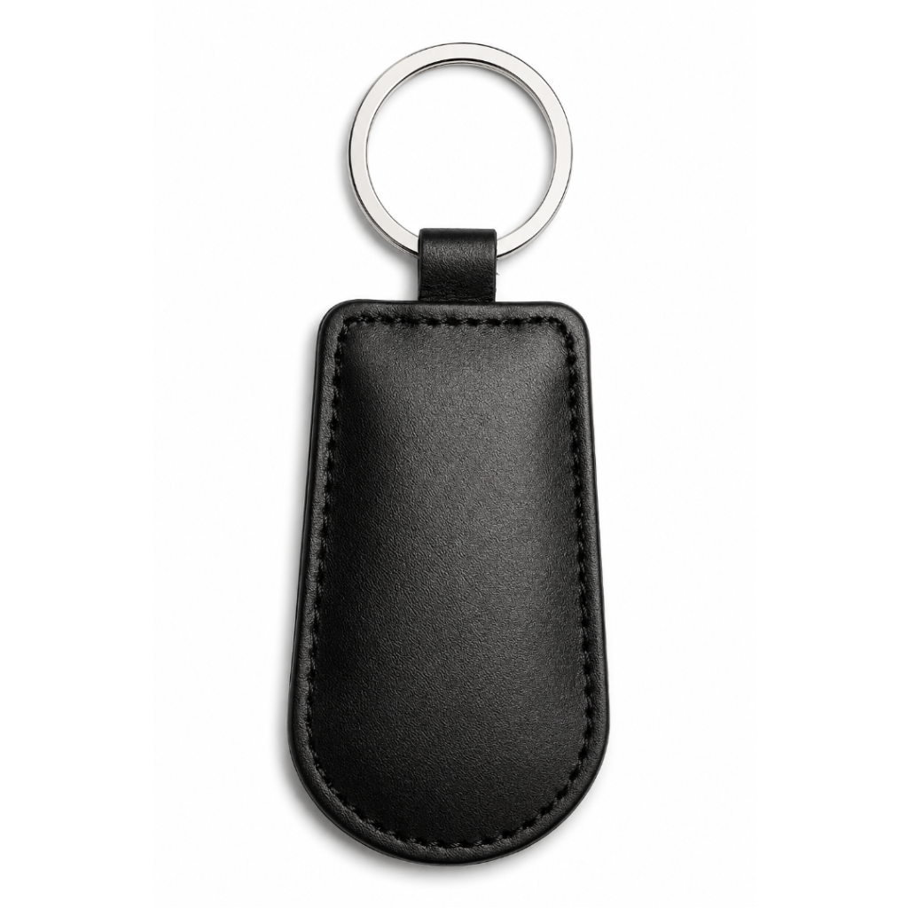 Black leather key fob with silver key ring on a white background