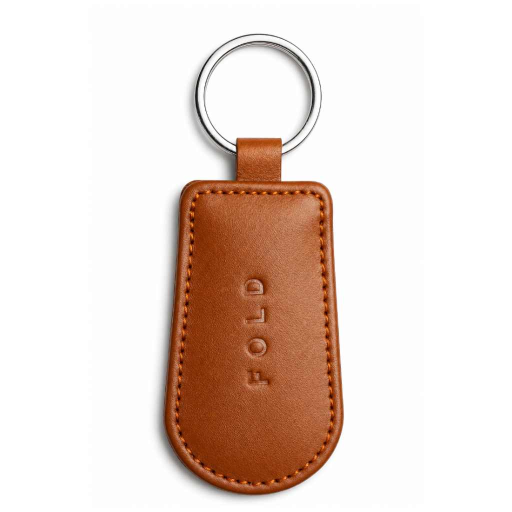 Brown leather keychain with 'FOLD' branding on a white background