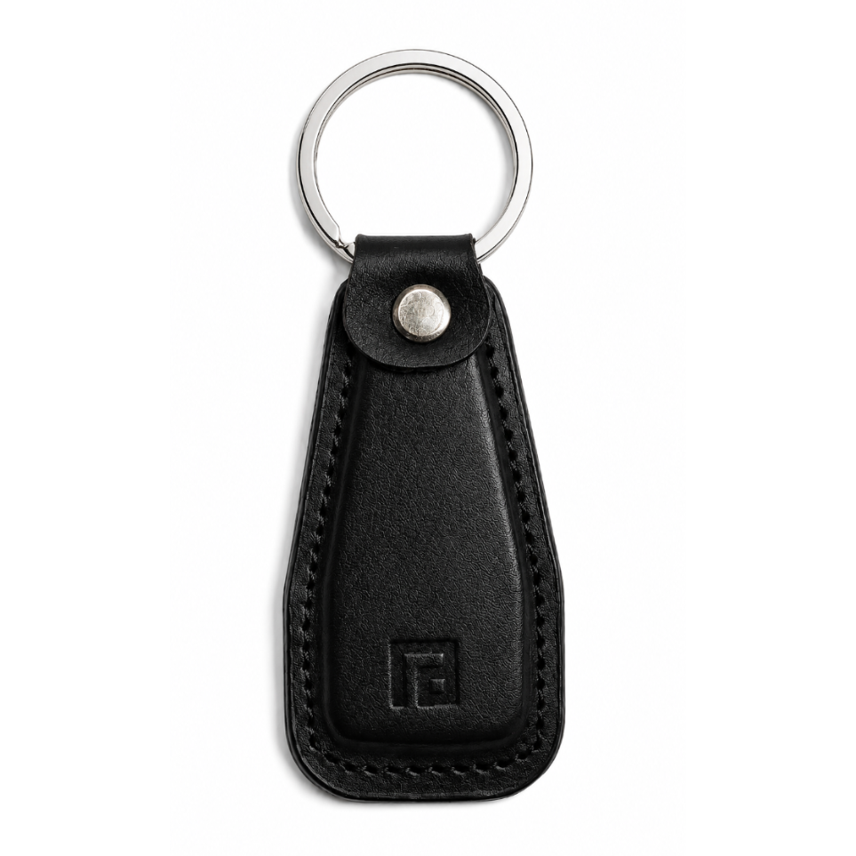 Black leather keychain with a metal ring on a white background