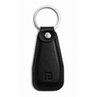 Black leather keychain with a metal ring on a white background