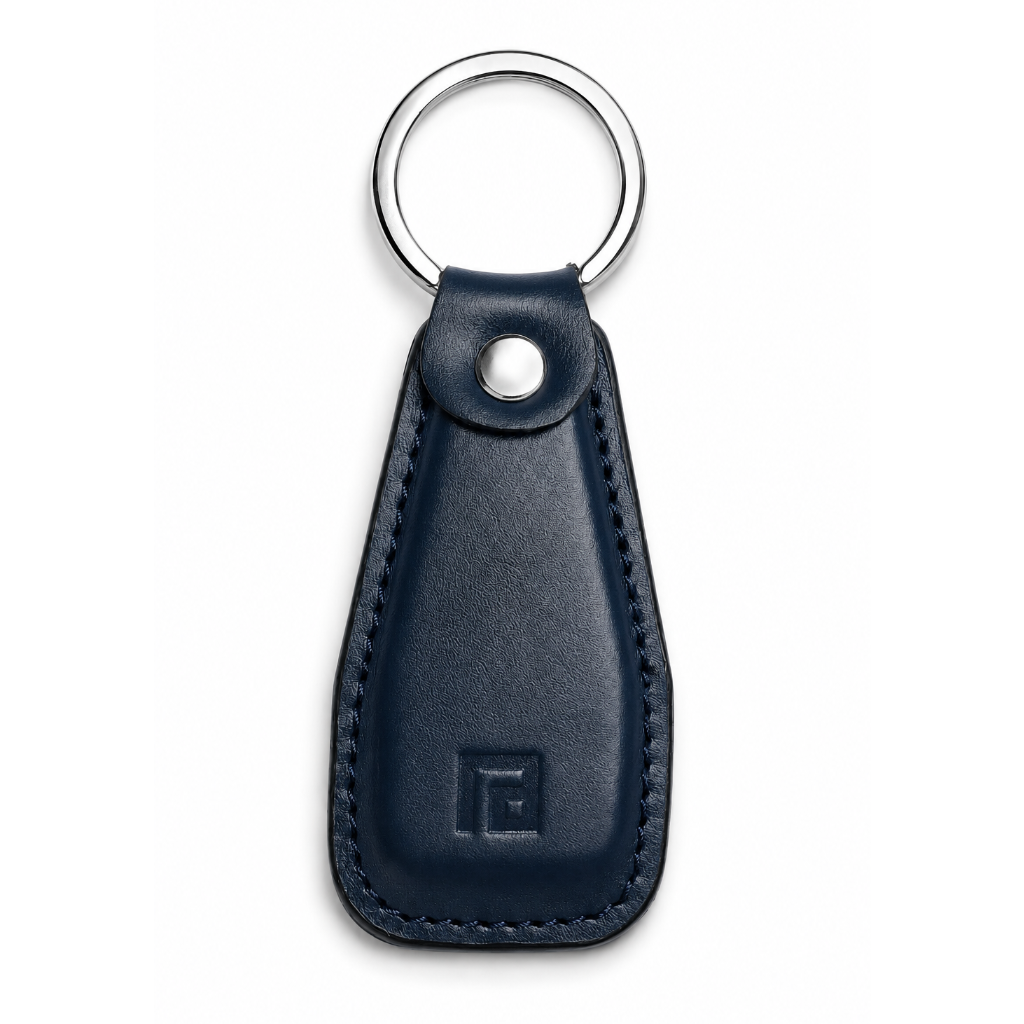 Black leather keychain with a metal ring on a white background