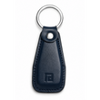 Black leather keychain with a metal ring on a white background