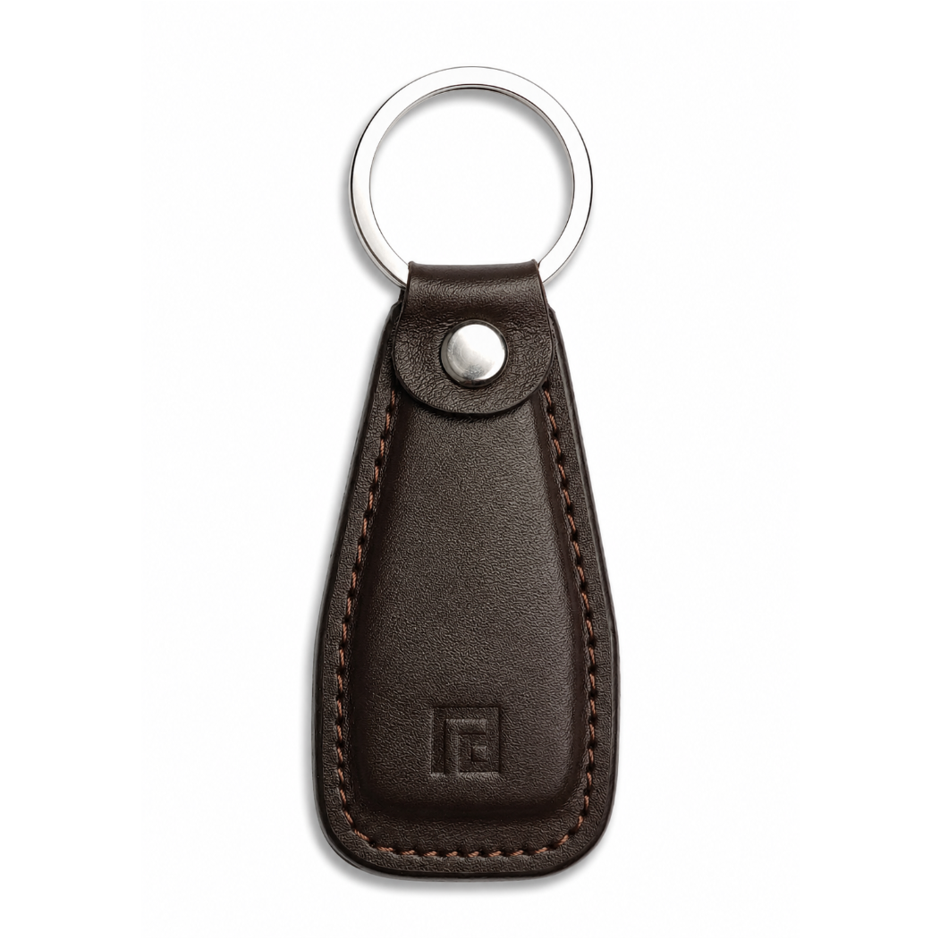 Brown leather keychain with a metal ring on a white background