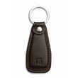 Brown leather keychain with a metal ring on a white background