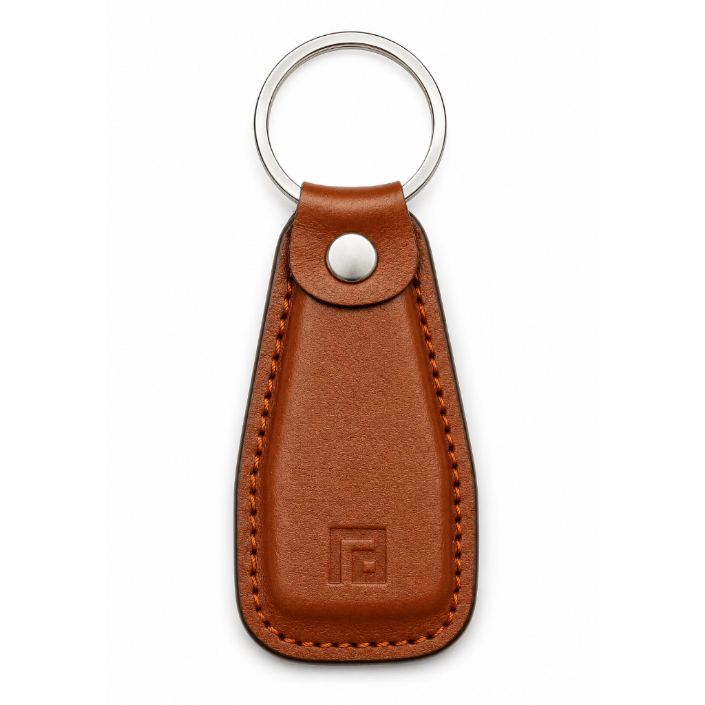 Brown leather keychain with a metal ring on a white background