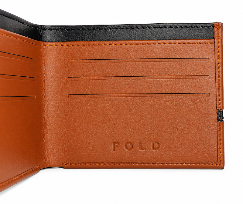Fold slim tan and black leather wallet close-up